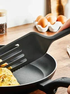 Tefal Keittiötarvikkeet|paistolasta leikkuureunalla Essential 2in1